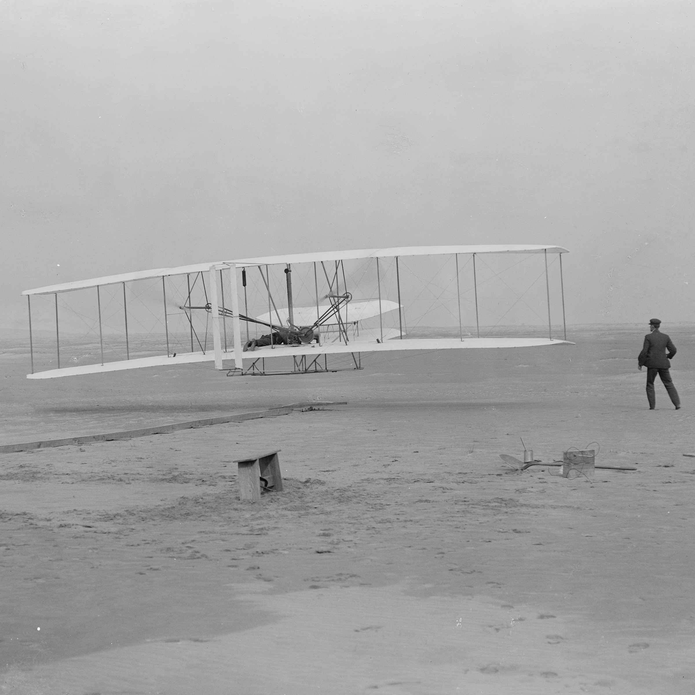 This is a photograph taken a few seconds after the 1903 Wright flyer took off on the first powered airplane flight.